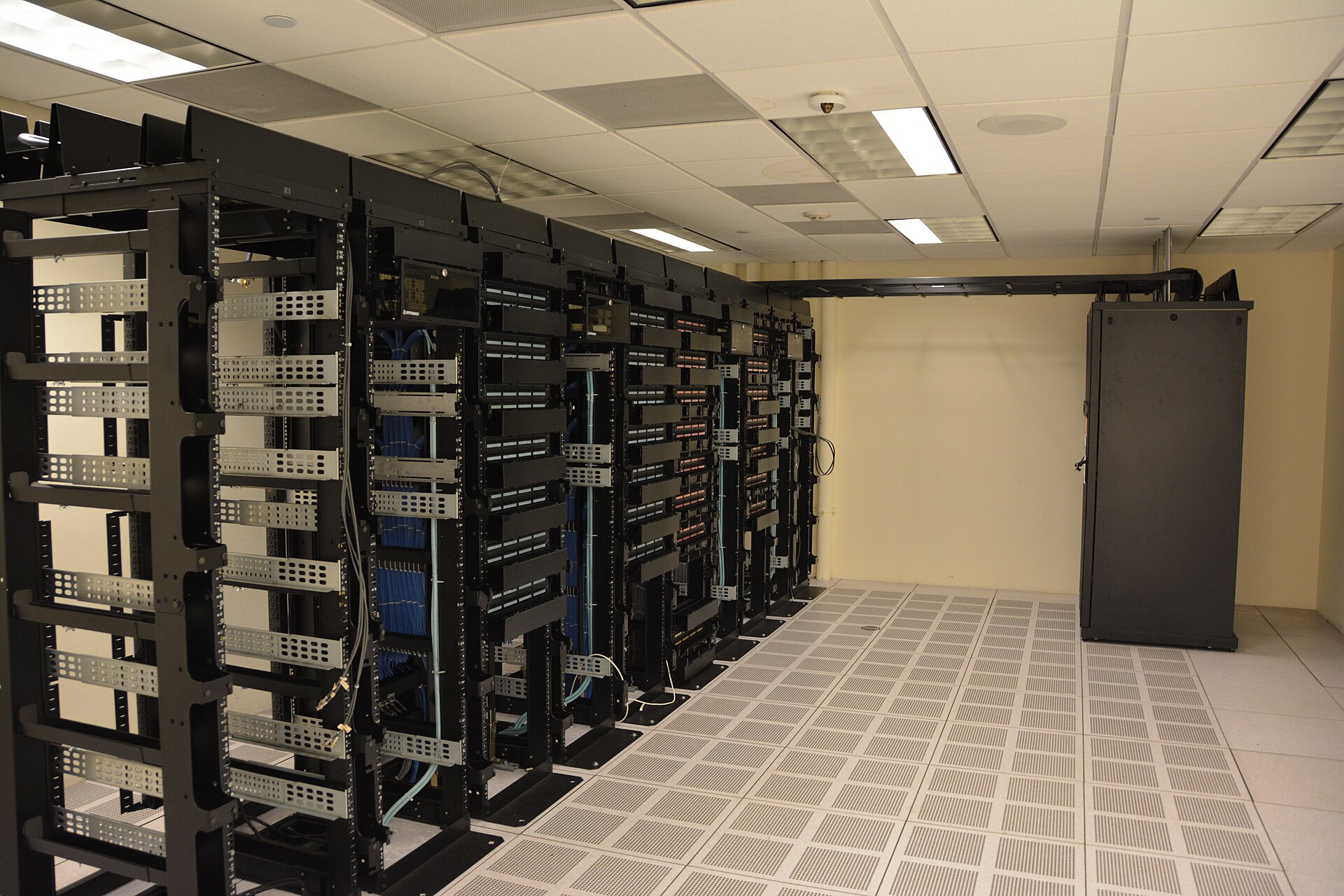 Rows of anonymous server racks in a data center